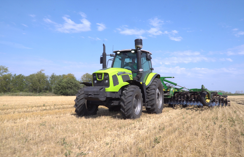 Wheeled Tractor PL2304 working on the field in Satpayev, Kazakhstan